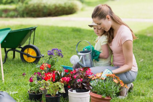 Professional landscaper planning garden design in East Ham